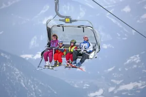 Family in the chair lift to Hochwurzen