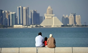Family on corniche, promenade, Sheraton Hotel