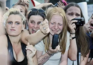 Fans of the boy band Caught in the Act cry