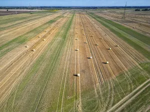 Farmland after harvest, hay bales
