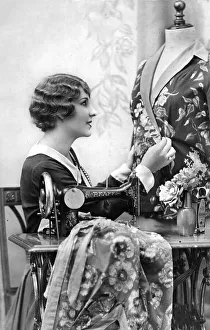 Fashion designer, tailor with sewing machine