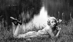 Fashion, Woman in summer dress in grass on a lake