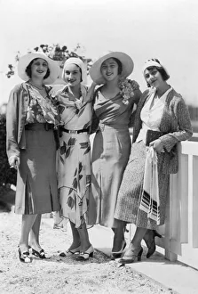 Fashion, four women posing with hats and dress