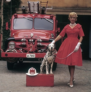 Fashionable in the 1950s. A young woman in a red dress