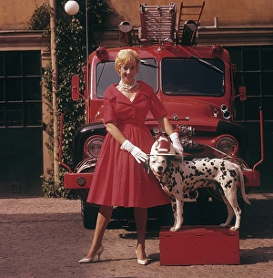 Fashionable in the 1950s. A young woman in a red dress