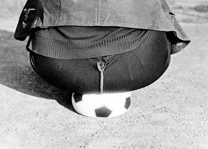 Fat man sits on soccer ball, ca