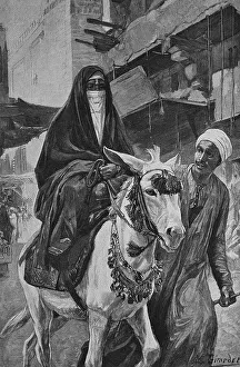 Female donkey rider in Cairo, Egypt