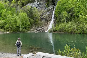 female hiker looking at the Saarbach waterfall