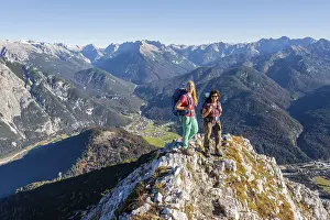Two female hikers on a summit, mountain landscape near the Grosse Arnspitze