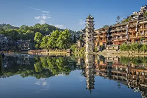 Feng Huang, China - August 2019 : Landmark Fenghuang Wanming Pagoda Tower on the riverbank of Tuo river