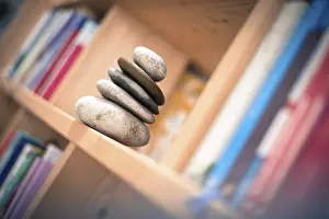 Feng Shui: Stone cairn at home in a book shelf
