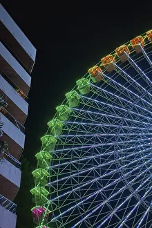 Ferris wheel near a building in Vigo