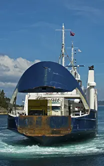 Ferry approaching the pier with an open bow section