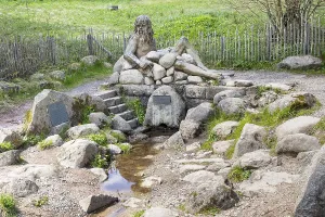 Figure of the river god Danuvius by sculptor Wolfgang Eckert at the source of the Breg