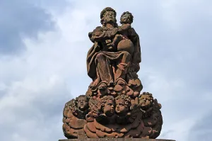 Figure of the Virgin Mary at the fountain of a baroque garden