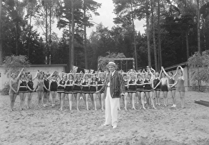 Filming in the 1930s. Swedish actor Sigurd Wallen, 1884-1947. Pictured here in front of a group of ladies in swimsuits during the filming of Skepp Ohoj from 1931