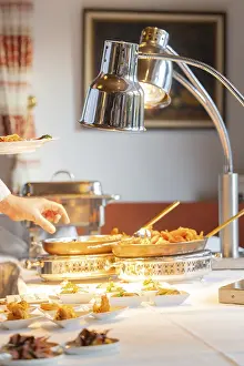 A fine buffet in the restaurant is lovingly presented under a lamp