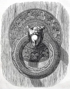 A finely chiselled iron ring, door handle on one of the inner doors of Bourges Cathedral