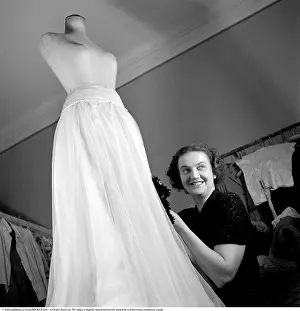 Finishing the fashionable evening dress 1948