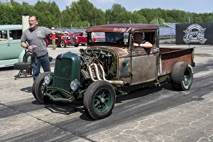 FINOWFURT, GERMANY - JUNE 28, 2024: The custom hot rod (pickup truck) on the racing line