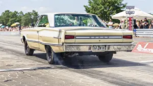 FINOWFURT, GERMANY - JUNE 28, 2024: The mid-size car Dodge Coronet (1966) on the racing line