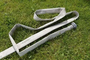 Fire hose in a meadow