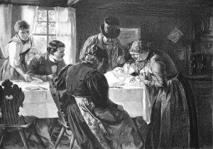 The first-born, Anne Baebi Jowaeger sits at the table with the assembled family