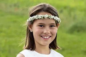First communion, girl with wreath of flowers in her hair