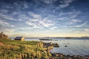Fisherman's cabin on the fjord in the evening light