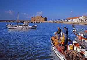 Fishing harbour, fort, fishermen mending nets, fishing boats, Paphos, Cyprus / Greek part
