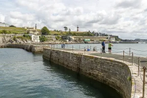 Fishing from harbour wall, seafront coastline waterfront