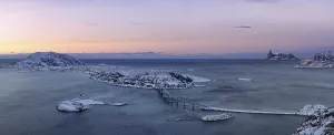 Fjord with islands and a bridge during the blue hour