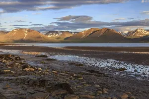 Fjord, low tide, stones, mountains