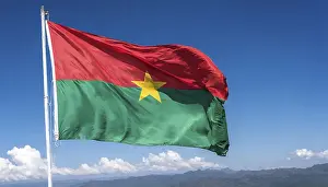 The flag of Burkina Faso flutters in the wind