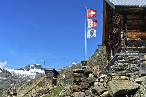 Flagpole with the flags of Switzerland