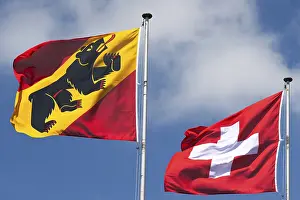 Flags of the city and canton of Bern and Swiss flag in the wind