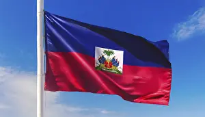 Flags, the national flag of Haiti flutters in the wind