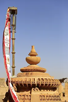 Flags and detail reliefs on rooftops of Jain temple in Jaisalmer