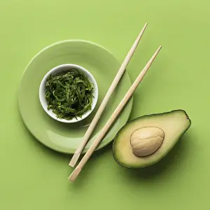 Flat lay avocado with bowl greens
