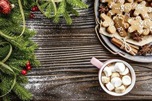 Flat lay Christmas background of pink mug with hot chocolate and marshmallows