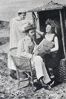 Flirt at the beach chair, husband reading the newspaper