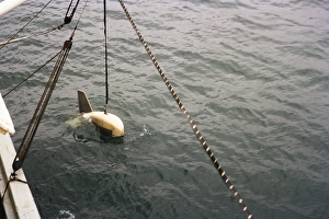 Floating device for scientific investigation of the seabed Echosounder Acoustics lowered into the sea Weymouth, England 1963