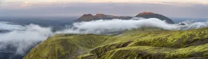 Fog between mountains, moss-covered volcanic mountain landscape
