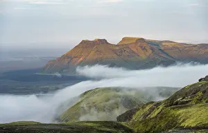 Fog between mountains, moss-covered volcanic mountain landscape