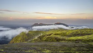 Fog between mountains, moss-covered volcanic mountain landscape