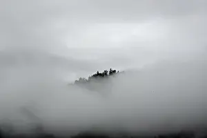 Foggy atmosphere in the foothills of the Alps