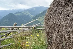 Framed Print : Foggy morning landscape with hay stack on meadow at highland Carpathian mountains