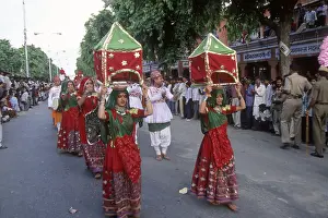 Folk dancers performing in teej festival