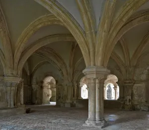 Fontenay former Cistercian monastery chapter house interior with view of the cloister