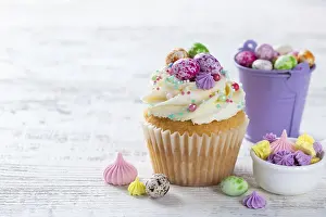 Framed Print : Food, Beautiful festive Easter cupcakes decorated with colorful sprinkles end candy eggs